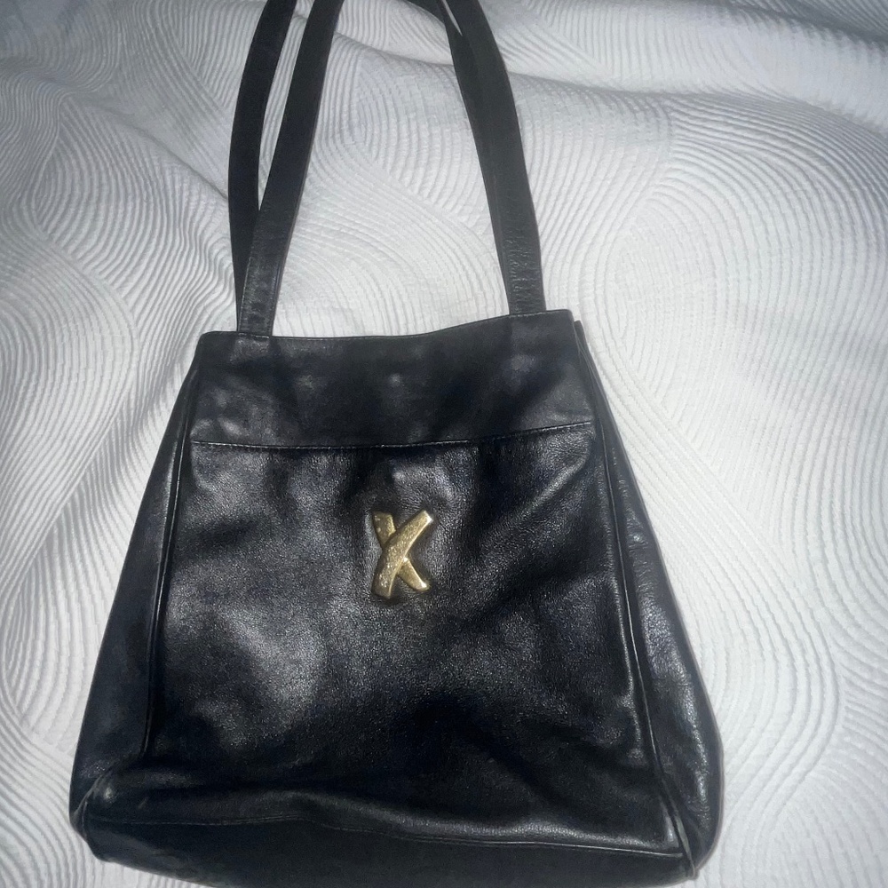 Paloma Picasso black leather vintage handbag w/gold accents, Near new condition
